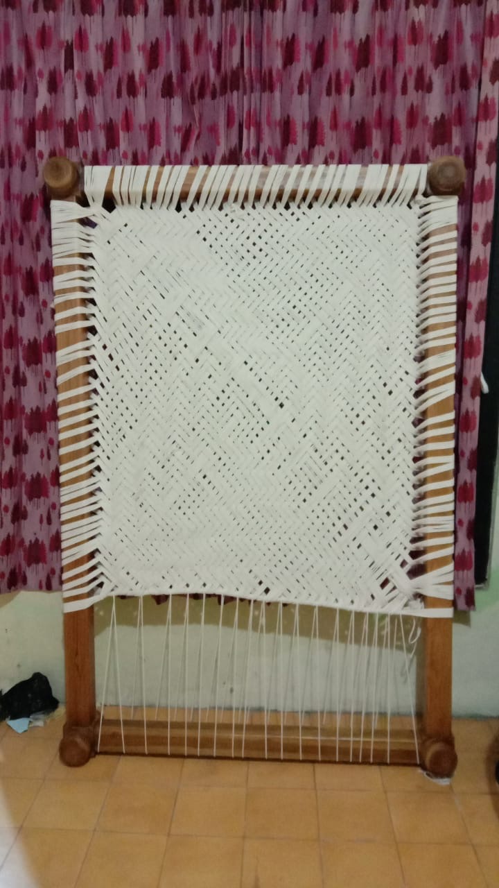 Wood-framed macramé decoration
